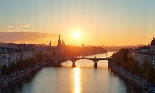 Vienna cityscape with famous landmarks and river at sunset